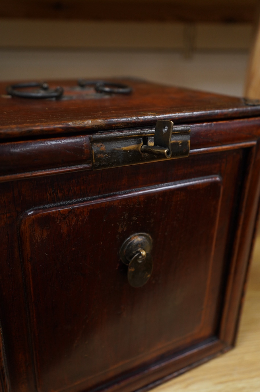 A 19th century Chinese elm scholar's seal cabinet with key, 31cm high. Condition - fair